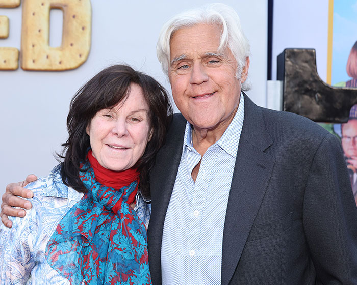 Jay Leno and his wife Mavis Leno posing, representing married people and the risk of dementia.