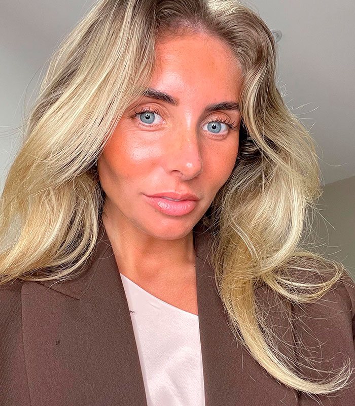 Close-up of a woman with blonde hair, blue eyes, and flushed cheeks, relevant to the bedroom mistake. Close-up of a woman with blonde hair, blue eyes, and flushed cheeks, relevant to the bedroom mistake.