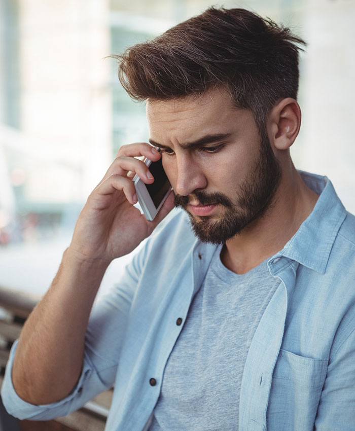 Man thinks the matter with aunt asking him money is done after he denies her, very wrong, looking at his phone. Man thinks the matter with aunt asking him money is done after he denies her, very wrong, looking at his phone.