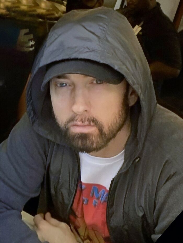 A portrait image of Eminem. This image shares curious facts about the famous rapper.