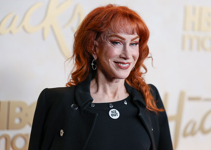A star in her 60s, with vibrant red hair, at an event, smiling, revealing her relationship. A star in her 60s, with vibrant red hair, at an event, smiling, revealing her relationship.