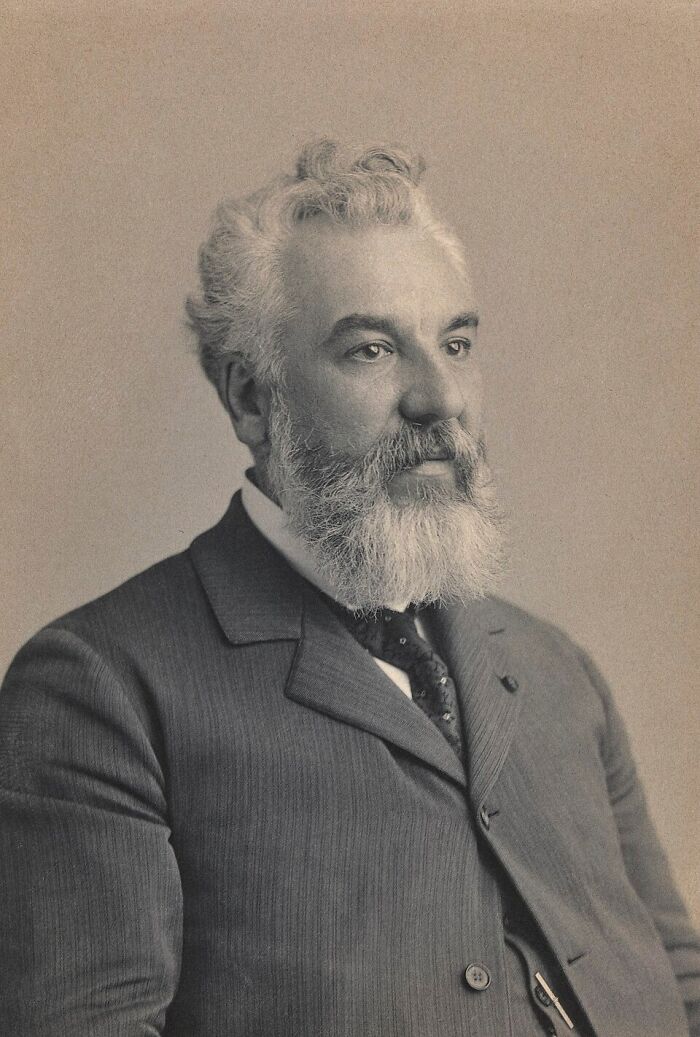 A black and white portrait of Alexander Graham Bell, an important figure in history facts.