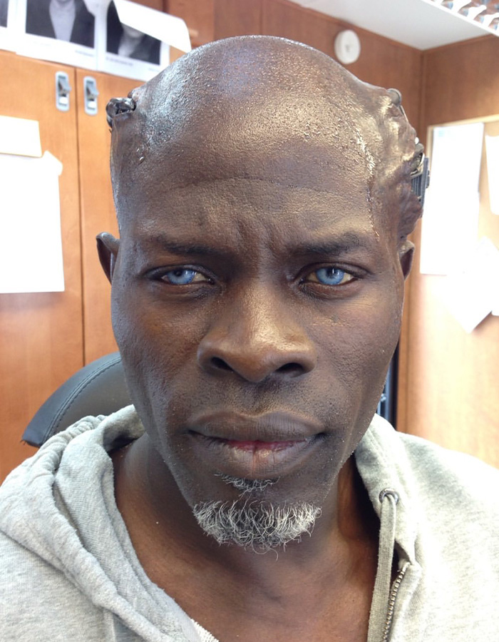 Hollywood Star's custody battle: actor in prosthetic makeup with blue contact lenses.