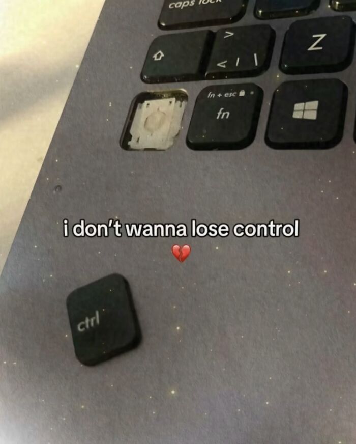 A relatable meme with a removed Ctrl key from a laptop, expressing 'I don't wanna lose control' to boost morale.
