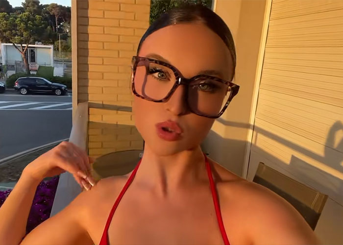 The viral Red Bikini Woman poses in stylish glasses, reflecting her new life after the party video. The viral Red Bikini Woman poses in stylish glasses, reflecting her new life after the party video.