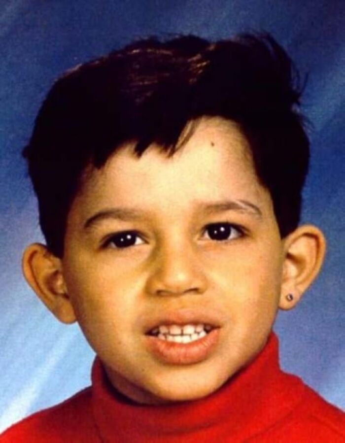 A young boy in a red turtleneck, an image related to cases that are mysteries with known blame.