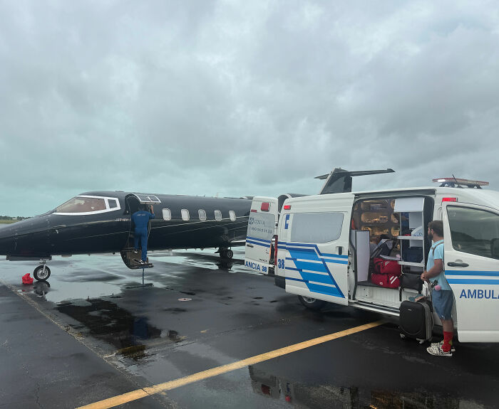 An ambulance and a private jet on a tarmac, involved in a medical transport for a catastrophic cruise injury. An ambulance and a private jet on a tarmac, involved in a medical transport for a catastrophic cruise injury.
