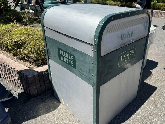 A trash can with the label PLEASE WASTE, an example of getting lost in translation in Japan.