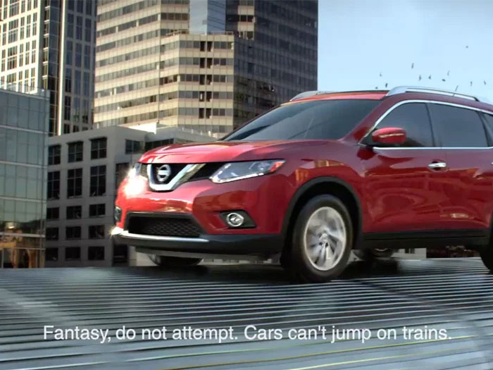 A hilariously dumb warning label on a car commercial showing a red Nissan SUV and text: Fantasy, do not attempt. Cars can't jump on trains.