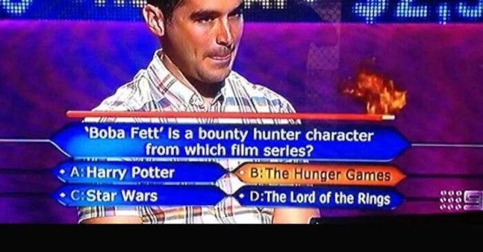 A game show contestant struggles with a simple question about Boba Fett, highlighting cultural decline into idiocy.