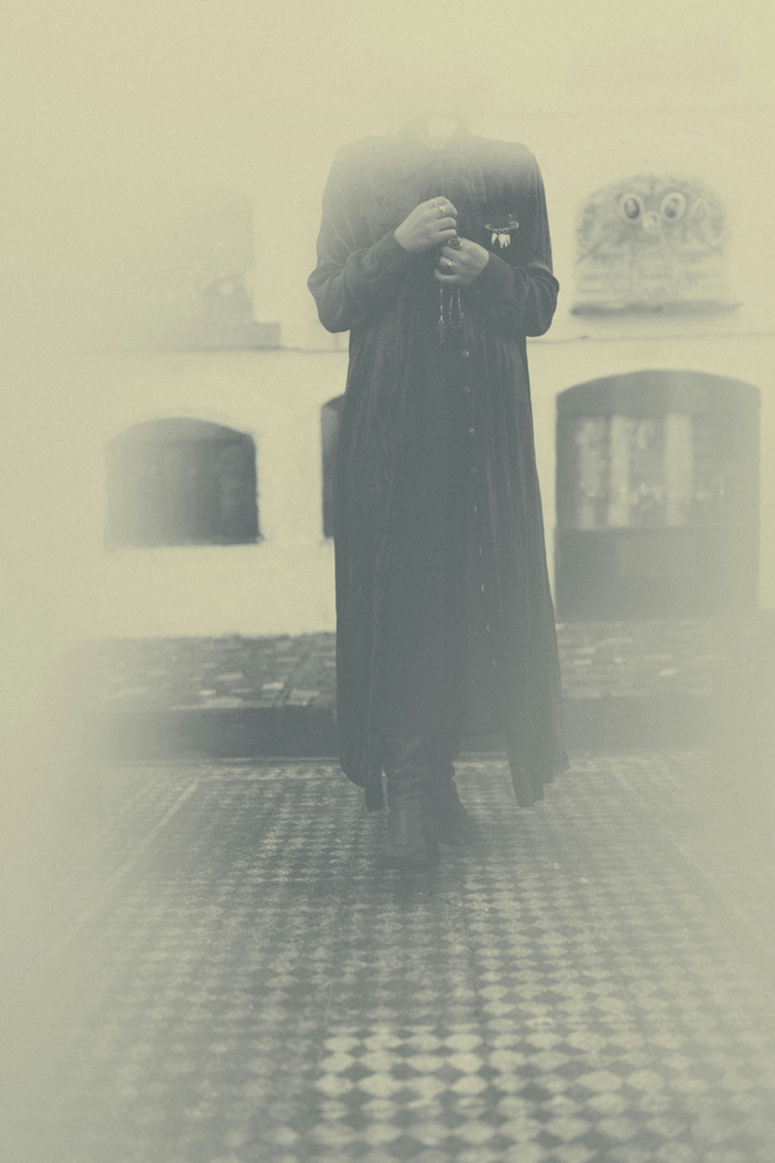 A headless figure in a long coat stands in fog, suggesting creepy and mysterious things happened to people.