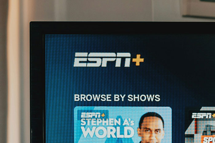 A television screen displaying the ESPN+ logo and Stephen A's World, a modern context for discussions about names.
