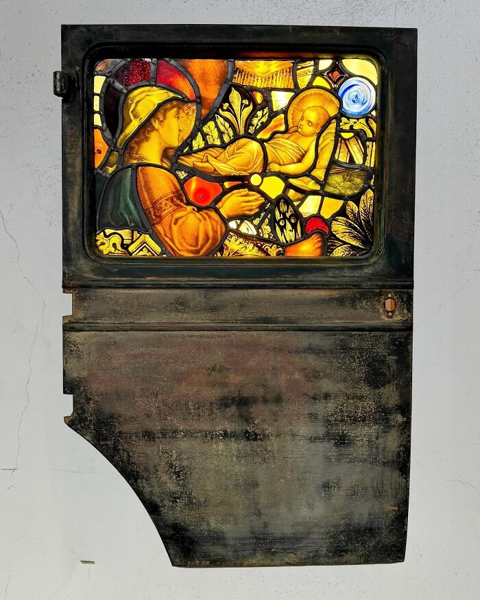 Burned and rusted Porsche 911 door transformed into an extraordinary stained-glass sculpture.