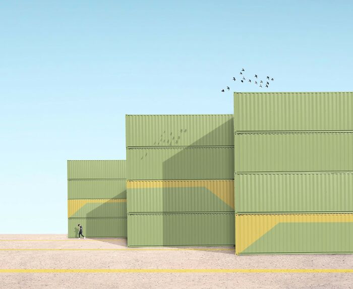 Minimalist color photo with a person walking past tall green shipping containers, capturing the world.