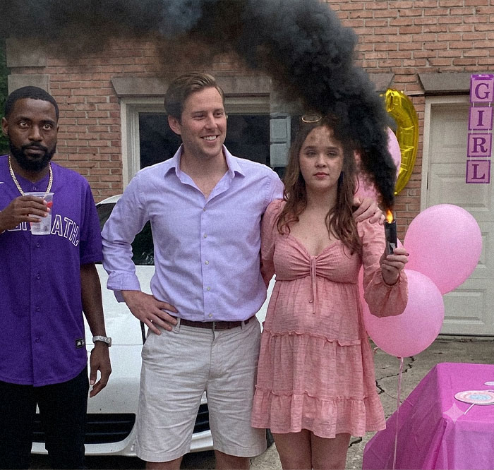 A cringe gender reveal party meme with black smoke and three people, showing unhinged absurdity.