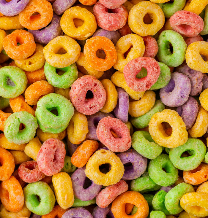 A colorful pile of loop-shaped cereal, illustrating the variety of men and their partners.