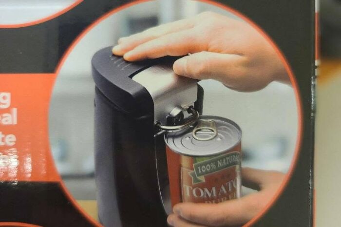 A close-up of hands using a can opener, highlighting the cultural decline of basic skills.