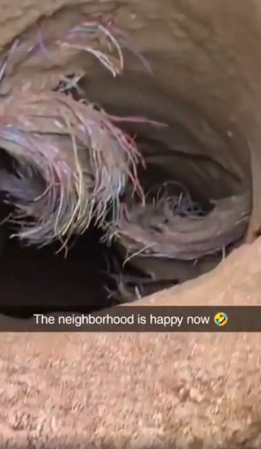 Frayed, colorful wires in a damaged underground conduit, an expensive mistake or accident.