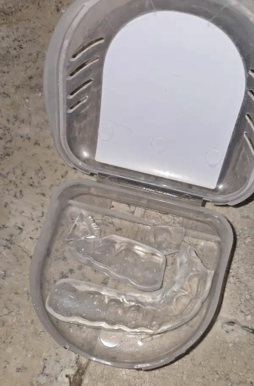 Clear dental retainers broken into pieces inside their case, an expensive mistake that is not my problem.