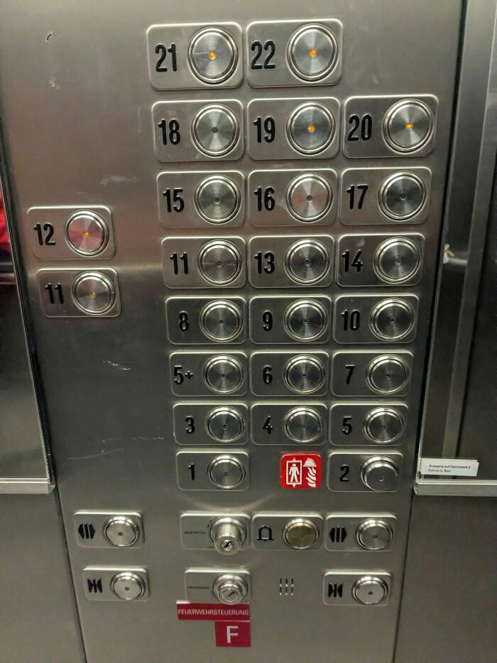 An elevator panel with an unusual numbering scheme, reflecting ridiculous posts about cultural decline into idiocy.