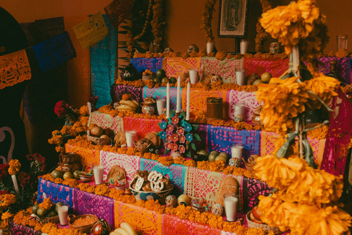 An elaborate altar with colorful decorations, candles, and offerings, for an article about men's complaints.