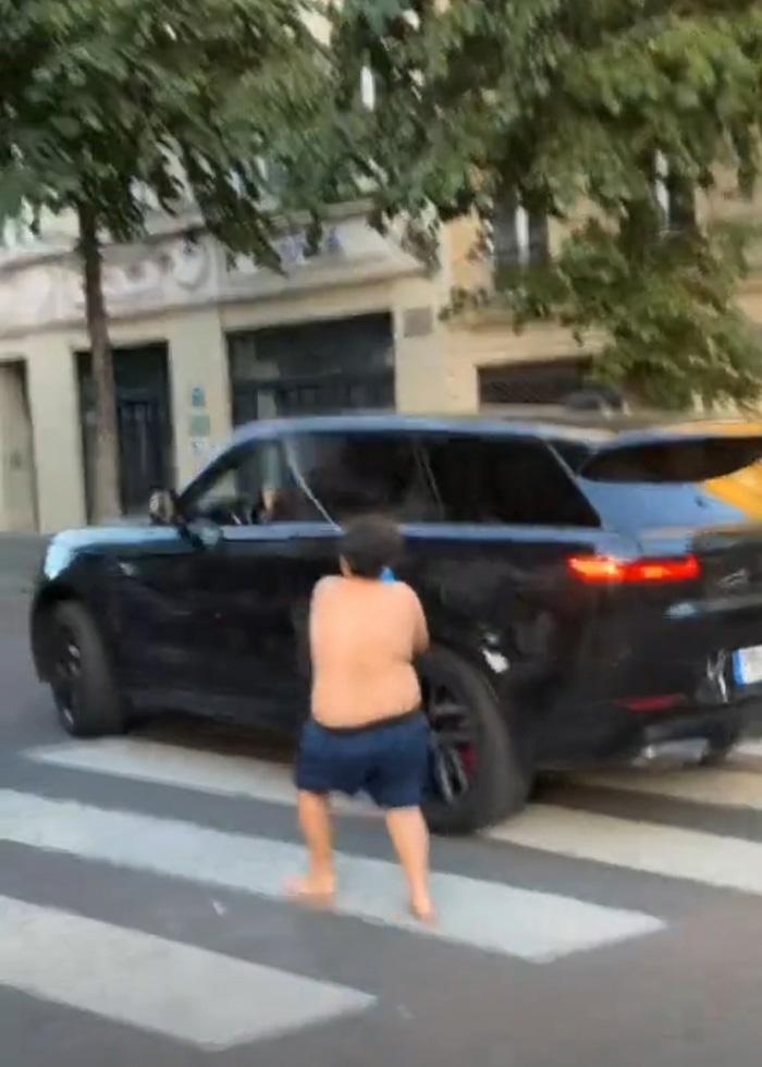 14-year-old boy aiming a water toy at a black car, involved in a controversial case. 14-year-old boy aiming a water toy at a black car, involved in a controversial case.