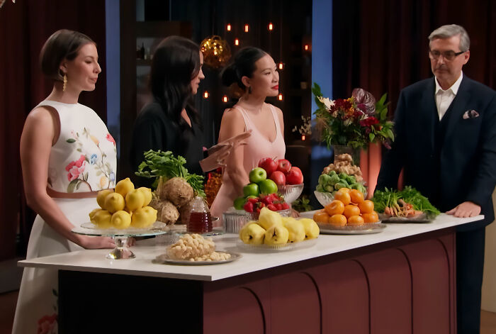 Meghan Markle, dressed in black, stands with others around a counter laden with fresh produce as alleged lies about her upbringing surface. Meghan Markle, dressed in black, stands with others around a counter laden with fresh produce as alleged lies about her upbringing surface.