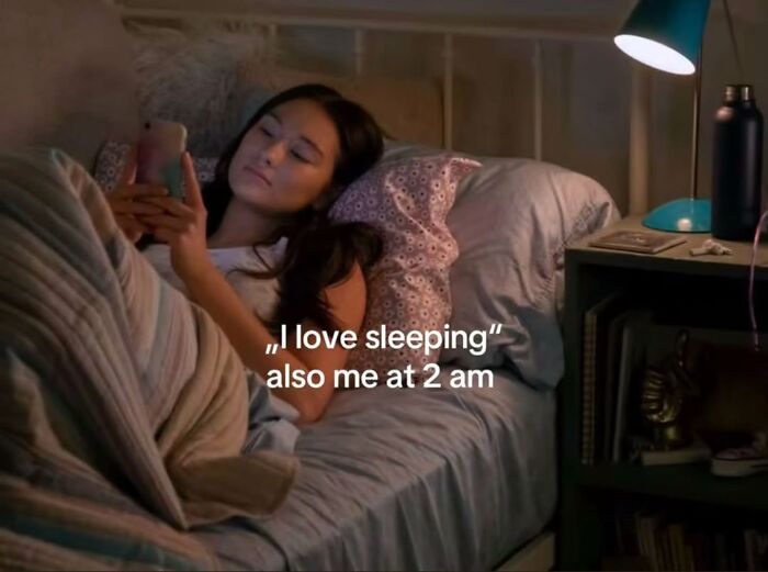 A relatable meme of a person on their phone in bed at 2 AM, despite loving sleep.