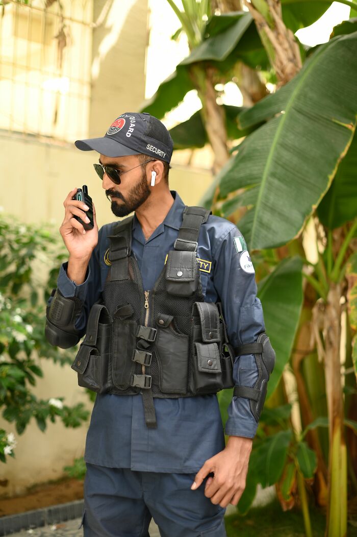A security guard communicating on a radio, highlighting a situation that could lead to someone getting fired from their job.