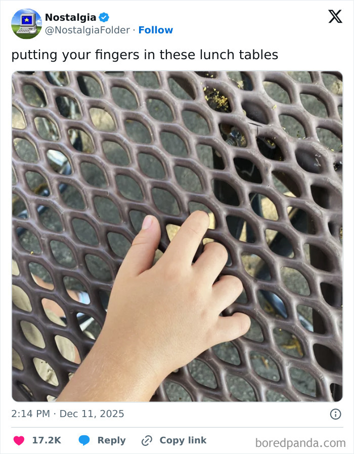 A hand puts fingers into a lunch table with honeycomb-shaped holes, evoking nostalgia.