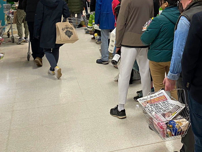 People waiting in a supermarket queue, a common setting for unexpected and clever comebacks.