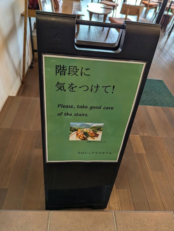 A green sign in Japan with the phrase Please, take good care of the stairs, a hilarious example of getting lost in translation.