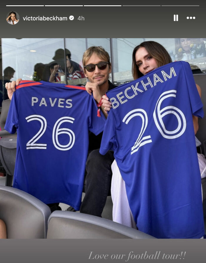 Victoria Beckham and a friend proudly display customized jerseys with Paves 26 and Beckham 26. Victoria Beckham and a friend proudly display customized jerseys with Paves 26 and Beckham 26.