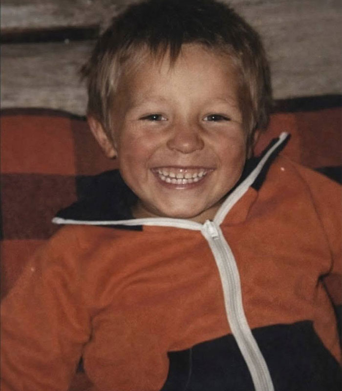Young boy smiling, whose disappearance revealed a horrific fate linked to a stray dog.
