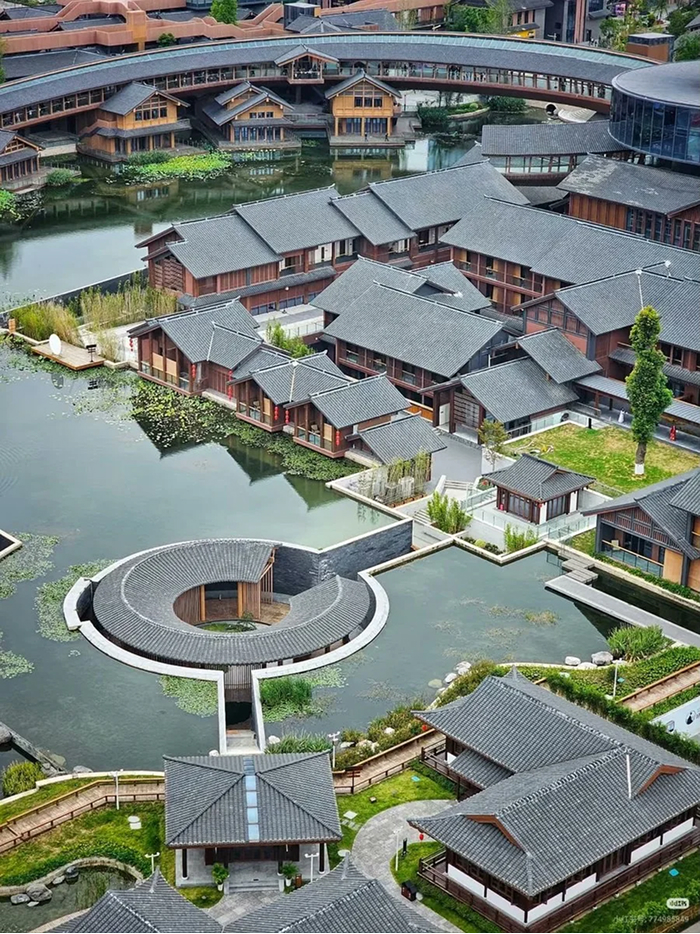 Modern Architecture Designs: A village of traditional buildings on a lake with a circular pavilion, beautiful and amazing architecture.