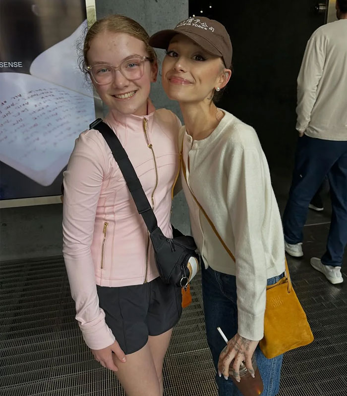 Ariana Grande is pictured with a young fan, showing a noticeable difference in their appearances that caused concern.