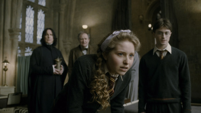 A group of celebrities, including Snape and Harry Potter, looking at a girl, portraying disillusioned celebrities.