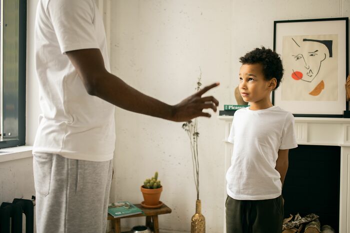 A child looking at a parenting expert, illustrating things kids pretend to understand but are confused by.
