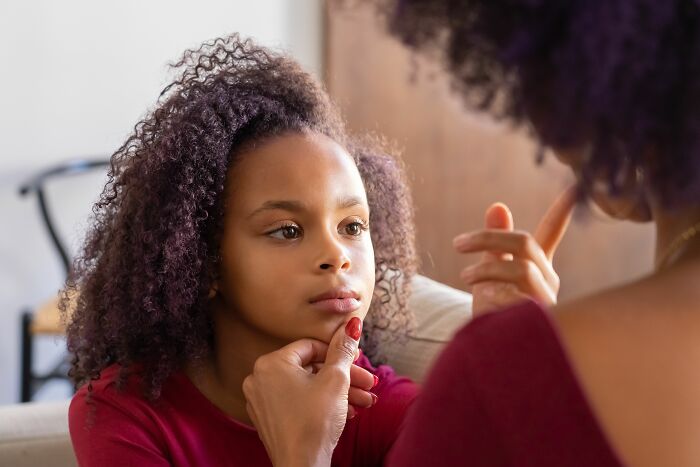 A parenting expert advising a young girl, highlighting things kids pretend to understand but are confused by.