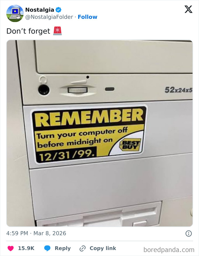 A close-up of a desktop computer with a yellow sticker that reads, REMEMBER Turn your computer off before midnight on 12/31/99, a nostalgic image.
