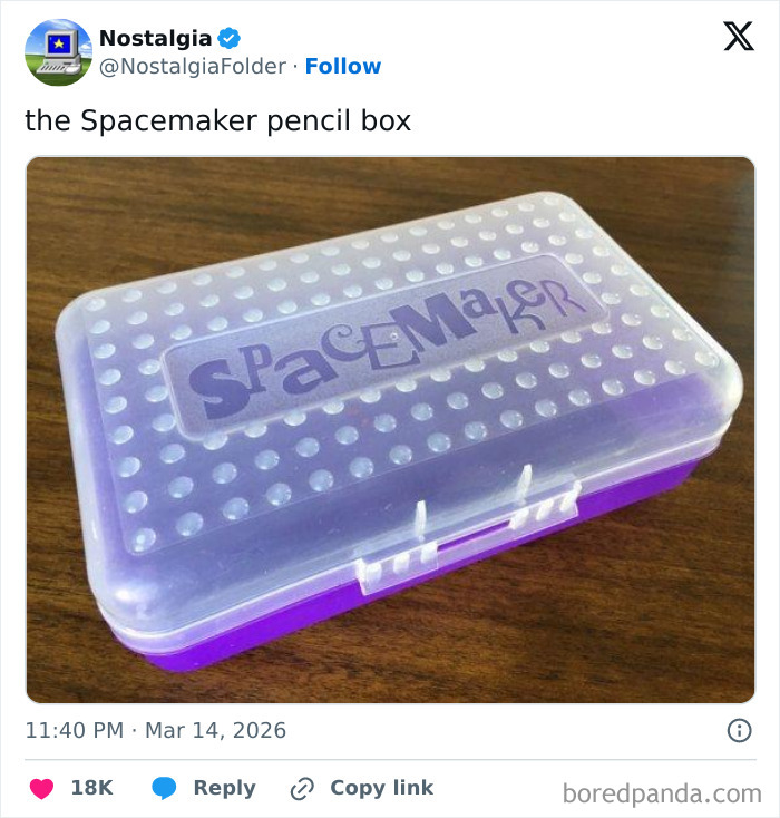 A translucent purple Spacemaker pencil box with a textured lid, sitting on a wooden surface, sparking nostalgia.