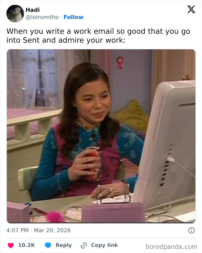 A meme of a girl smiling while looking at a computer screen, representing the painful reality of writing work emails.