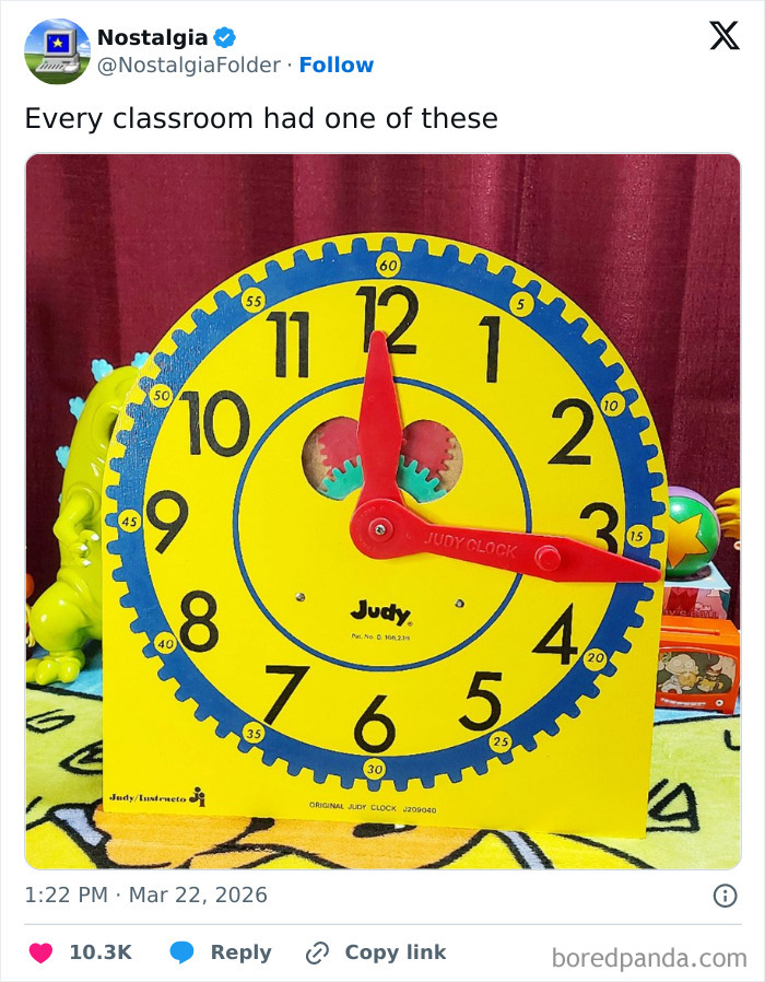 A large, yellow Judy Clock with red hands, commonly found in classrooms, a nostalgic item that might make you remember.