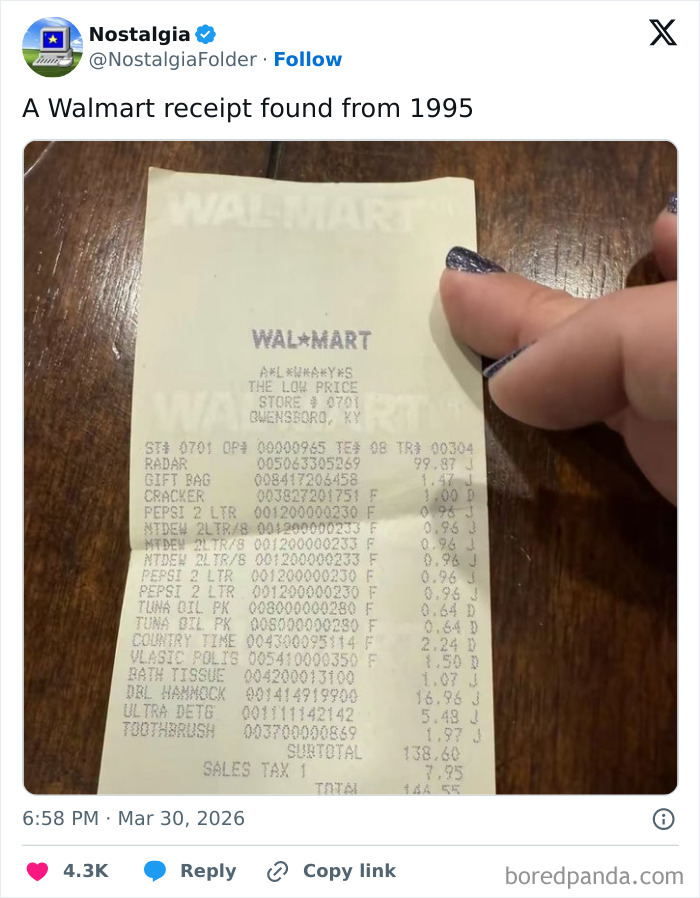 A hand holding a 1995 Walmart receipt, a classic item that might make you remember things from the past.