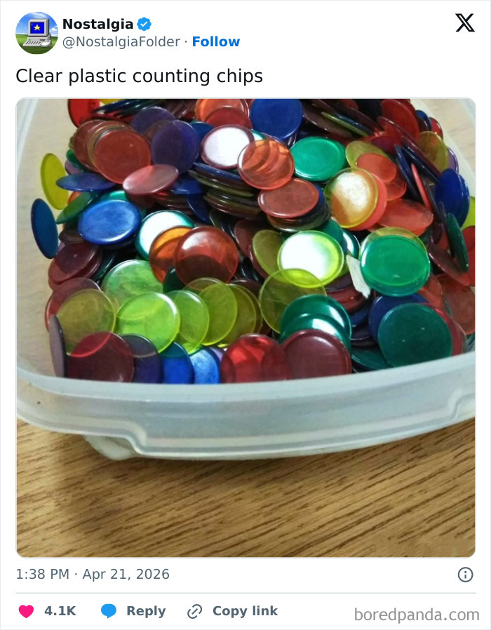 A pile of colorful, translucent counting chips in a white plastic container, a nostalgic reminder.