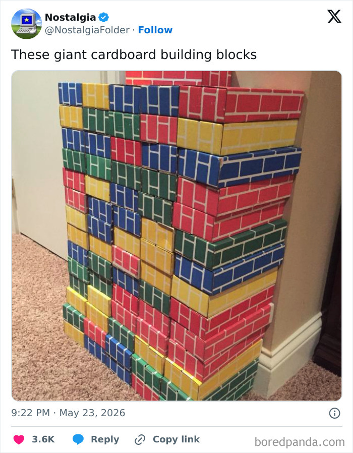 A stack of colorful cardboard building blocks, resembling bricks, evoking a sense of nostalgia for childhood play.
