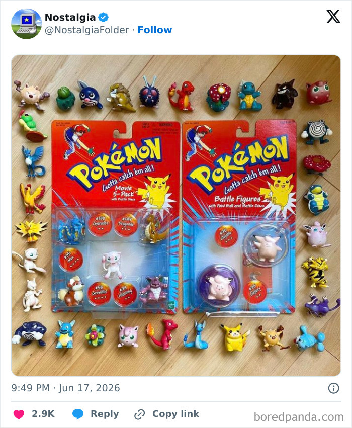 A collection of vintage Pokemon battle figures and packaged sets on a wooden surface, evoking nostalgia.