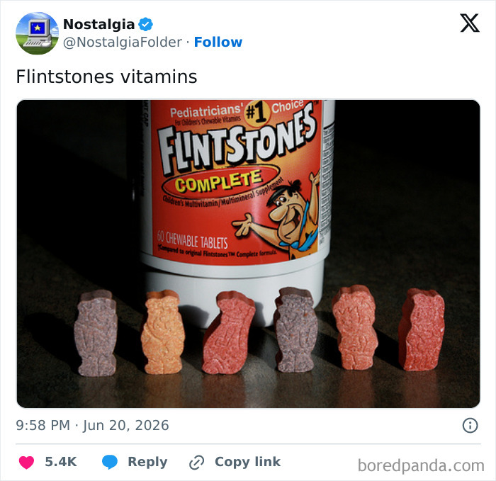 A bottle of Flintstones vitamins with several character-shaped vitamins lined up, evoking nostalgia.