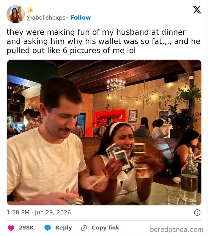 A man showing six pictures of a woman from his wallet to a laughing woman at a restaurant, one of the funnier moments on Twitter in June.