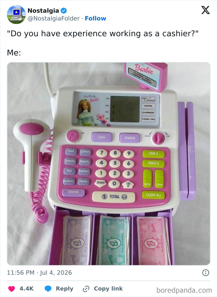 A pink and white Barbie cash register toy with fake money, reminding of childhood nostalgia.